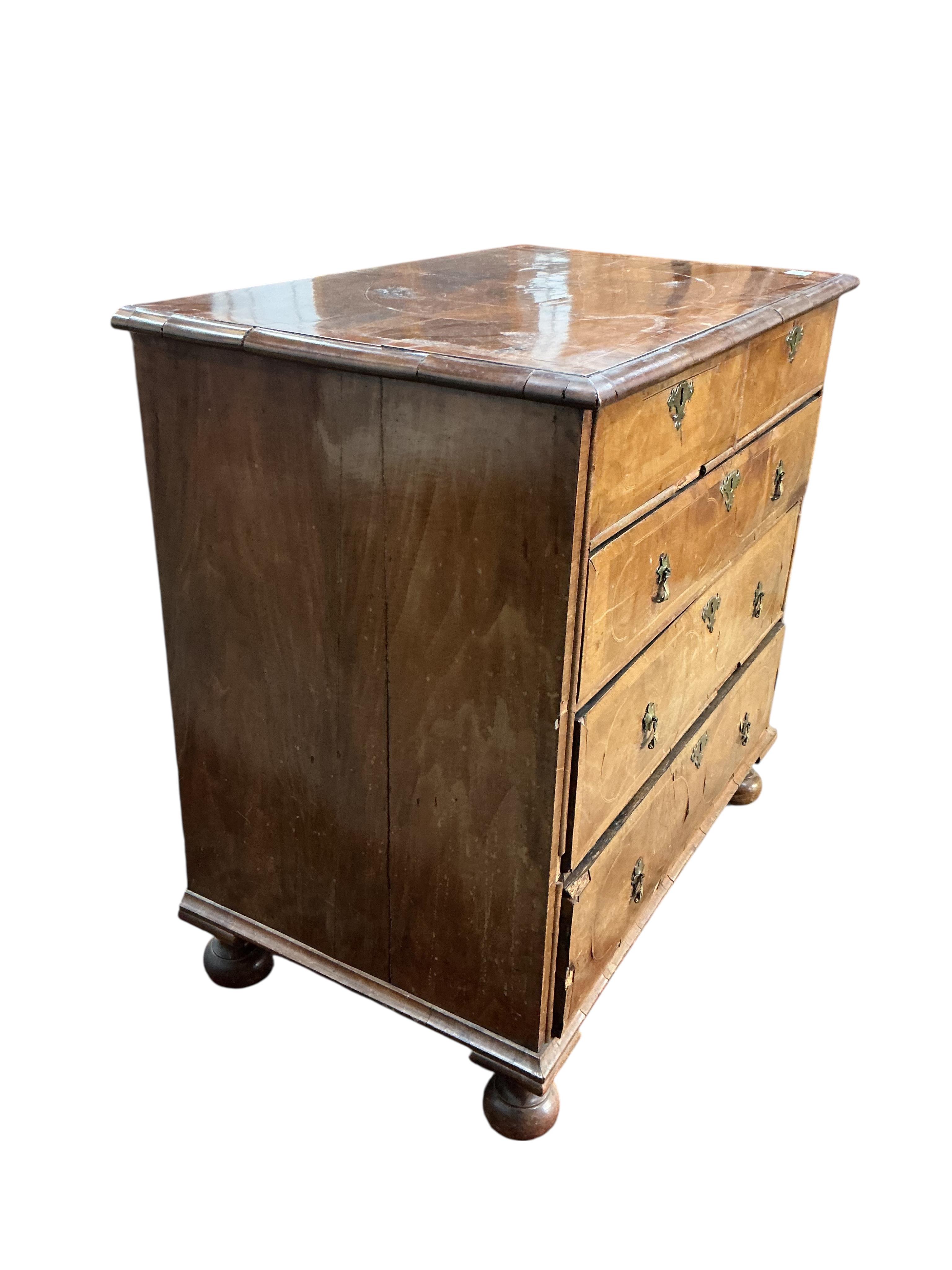 An 18th century inlaid walnut chest, width 97cm, depth 58cm, height 95cm